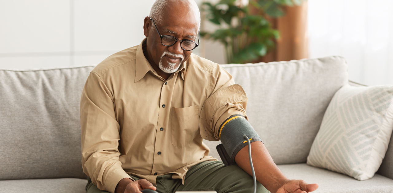 older male, senior , blood pressure monitor